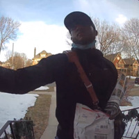Mail carrier image taken from a doorbell camera.