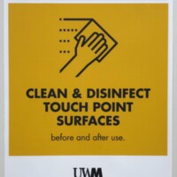 Photograph of a sign found in the Student Union asking users to clean and disinfect surfaces they use