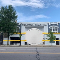 A photoshopped image of the Miramar Theatre wearing a giant face mask