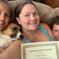 Determination Rewarded: Family selfie on the couch including the dog proud of Mom receiving  a Determination Award.