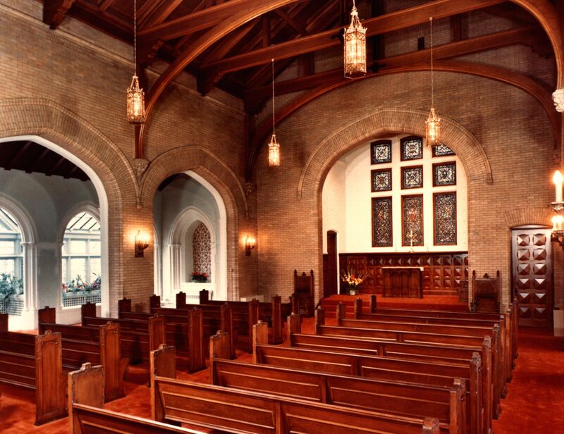 Photo of Chapel's interior enameled brick walls and oak millwork pews and ceiling.