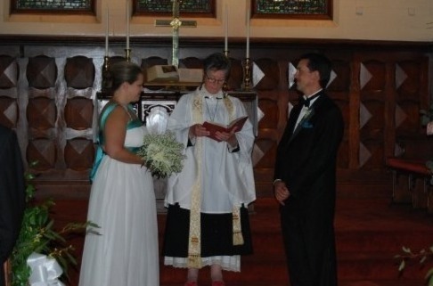 Photo of couple getting married inside the Forest Home Chapel