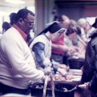 Photograph of the meal program from St. Benedict the Moor parish from the late 1970s.