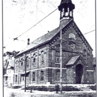 Historical photograph of the first official building for the St. Matthew C.M.E. Church.