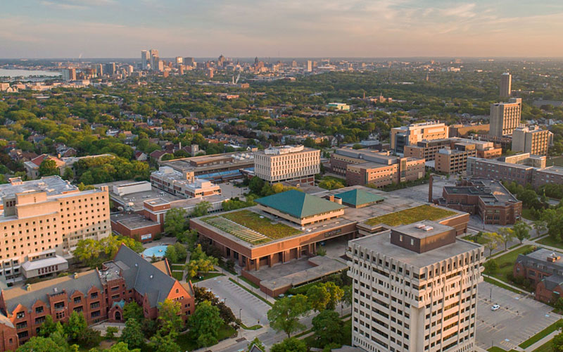 Photo of UWM Campus from above looking south, with downtown Milwaukee in background.
